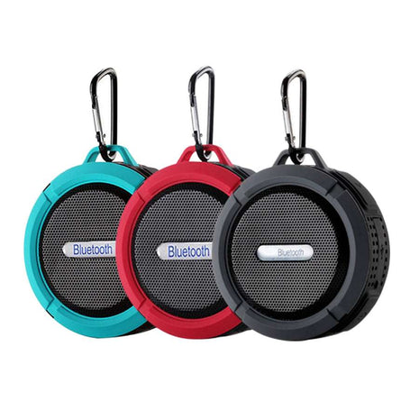 Waterproof Mini Speaker with Bluetooth, mic, and volume control in teal, red, and black colors. Ideal for shower or outdoor use with carabiner clip.